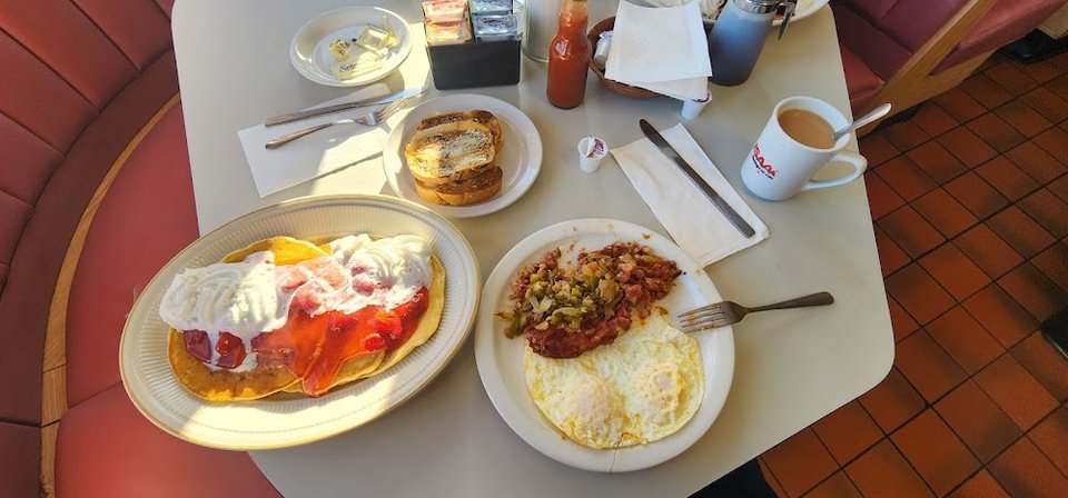 Restaurant menu featuring salads and egg dishes.