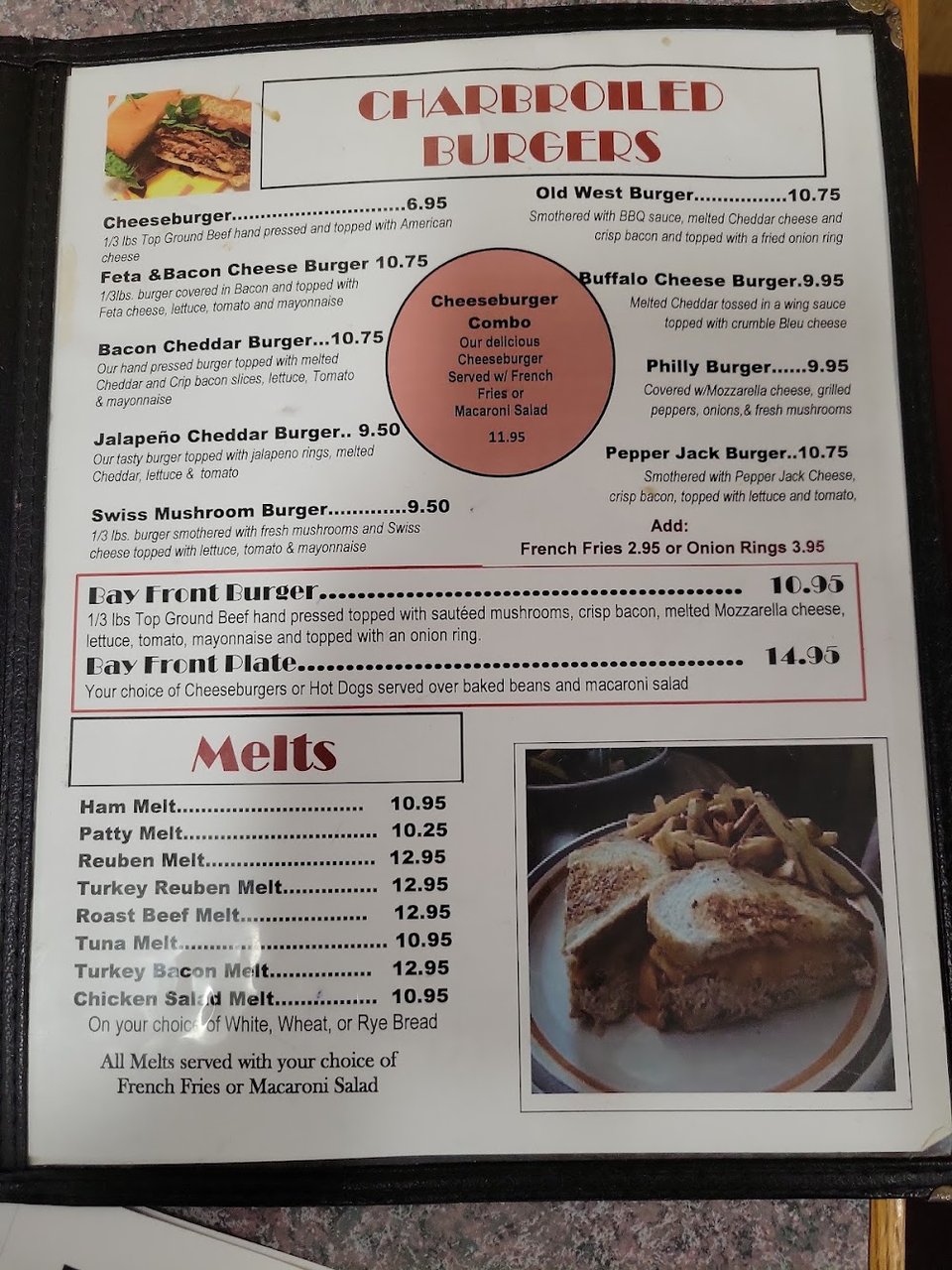 Restaurant menu featuring salads and egg dishes.